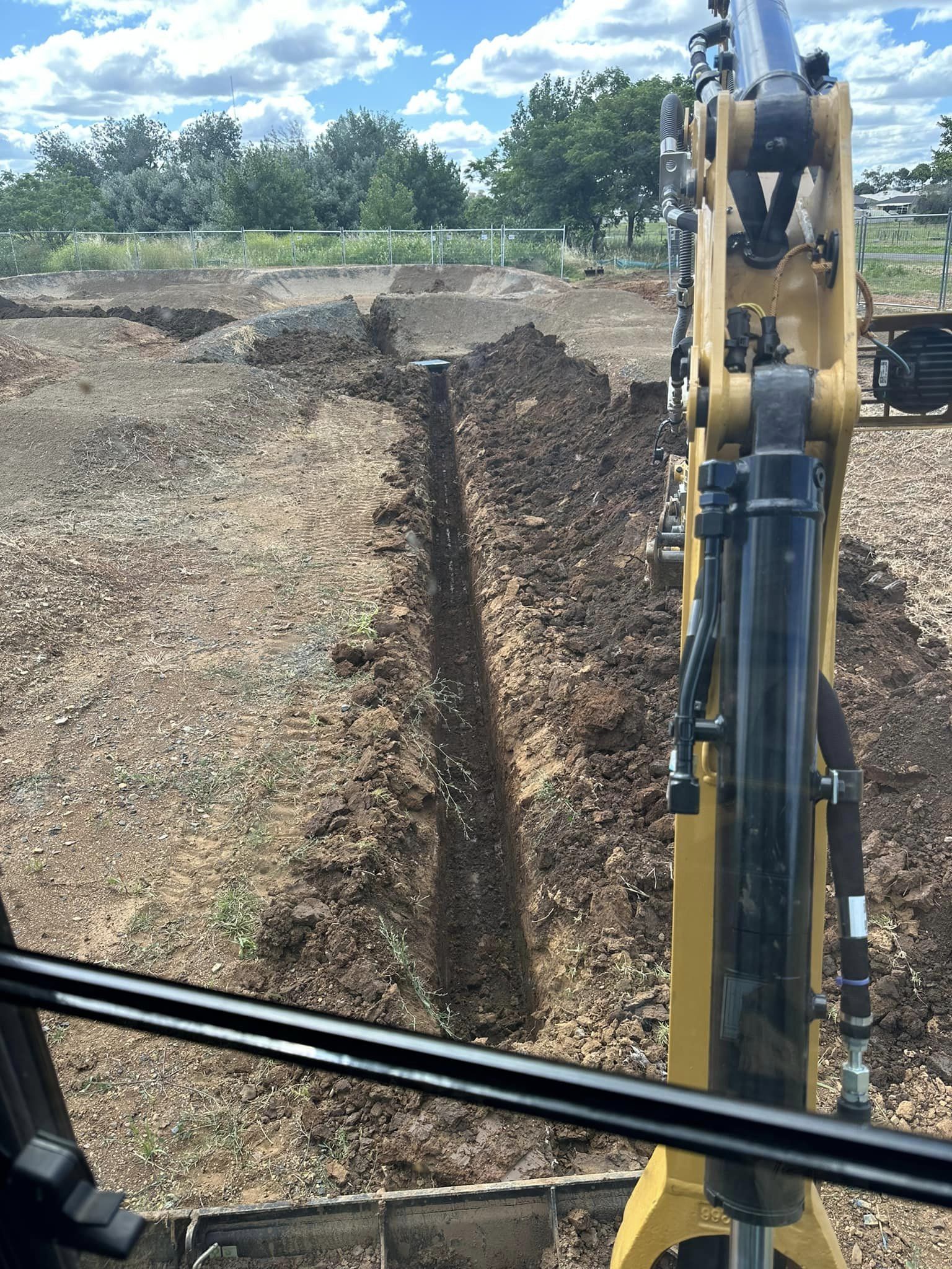 Brock Renshaw, owner of Renex Mini Excavations, with mini excavator, tipper truck, and skid steer, reflecting 10 years of expertise in high-quality excavation services.